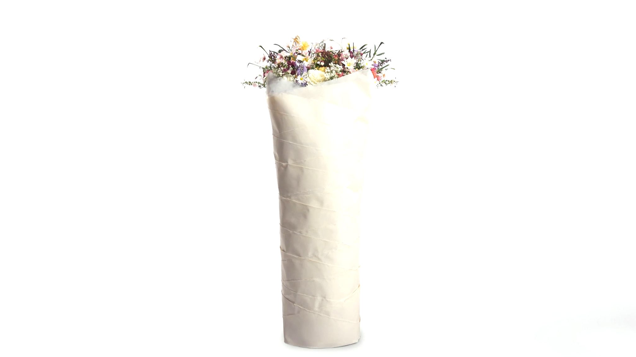 A bouquet tightly wrapped in several layers of ivory paper on a white background