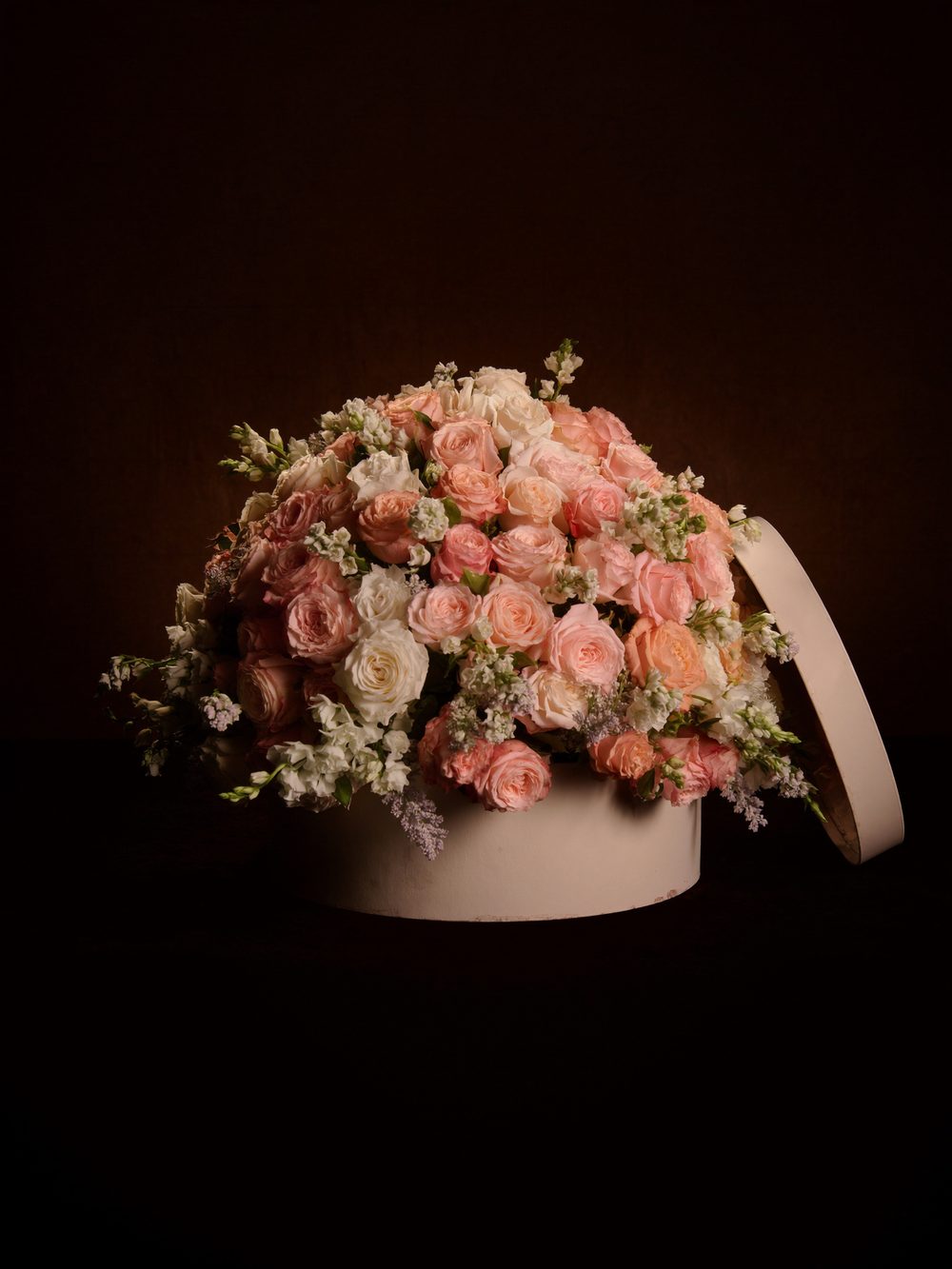 Roses in a round box
